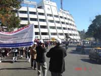 A procession rally with placards accompanied by the Band Party from Shillong Club