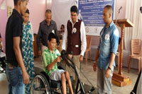 Shri. C.P Gotmare, Deputy Commissioner, Ri-Bhoi District, Nongpoh distributing tricycle to a person with disability