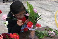 Marbareen Sun participates in flower arrangement