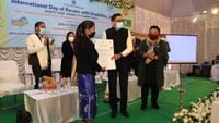 Shri. G. P. H. Raju, IPS, Principal Secretary to the Government of Meghalaya, Labour Department
 distributing UDID Certificate to a person with disability