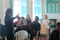 Miss. Ibalari Dhar, supporting staff of Bethany Society Mainstreaming unit teaching a basic Sign Language to the participants during the workshop
