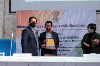 Chief  Minister  Conrad  K.  Sangma fecilitating Shri Dakynmawlang Warjri, a student with disabilities