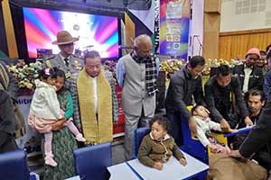 Group photo of His Excellency the Governor of Meghalaya, Shri C. H. Vijayashankar, other dignitaries and recipients of CP adaptive chairs