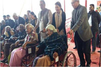 Shri. Krishan Pal Gurjar, Minister of State for Social Justice & Empowerment distributing wheelchairs to senior citizens under Rashtriya Vayoshri Yojana on 12.12.2017 at Ri-Bhoi, Nongpoh
